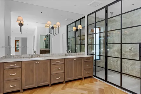 a bathroom with a double vanity sink and mirror