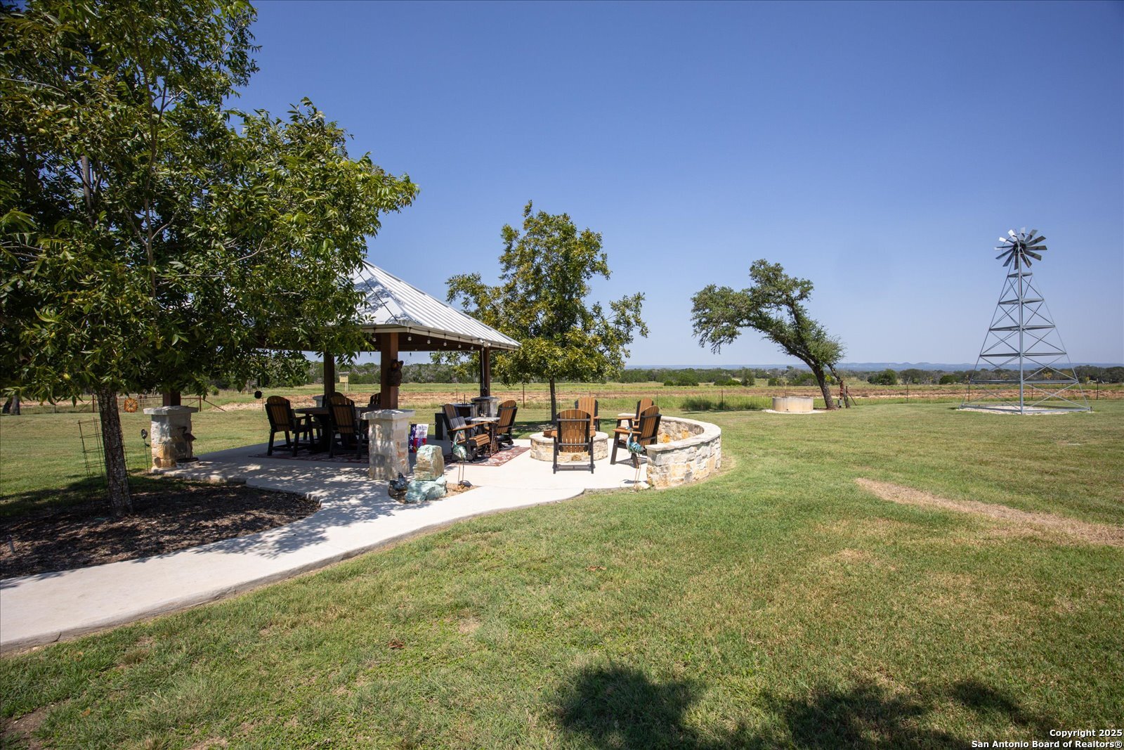 34 Cravey Road Boerne, TX 78006 - Photo 39 of 69 a view of a backyard with a sitting area and slide