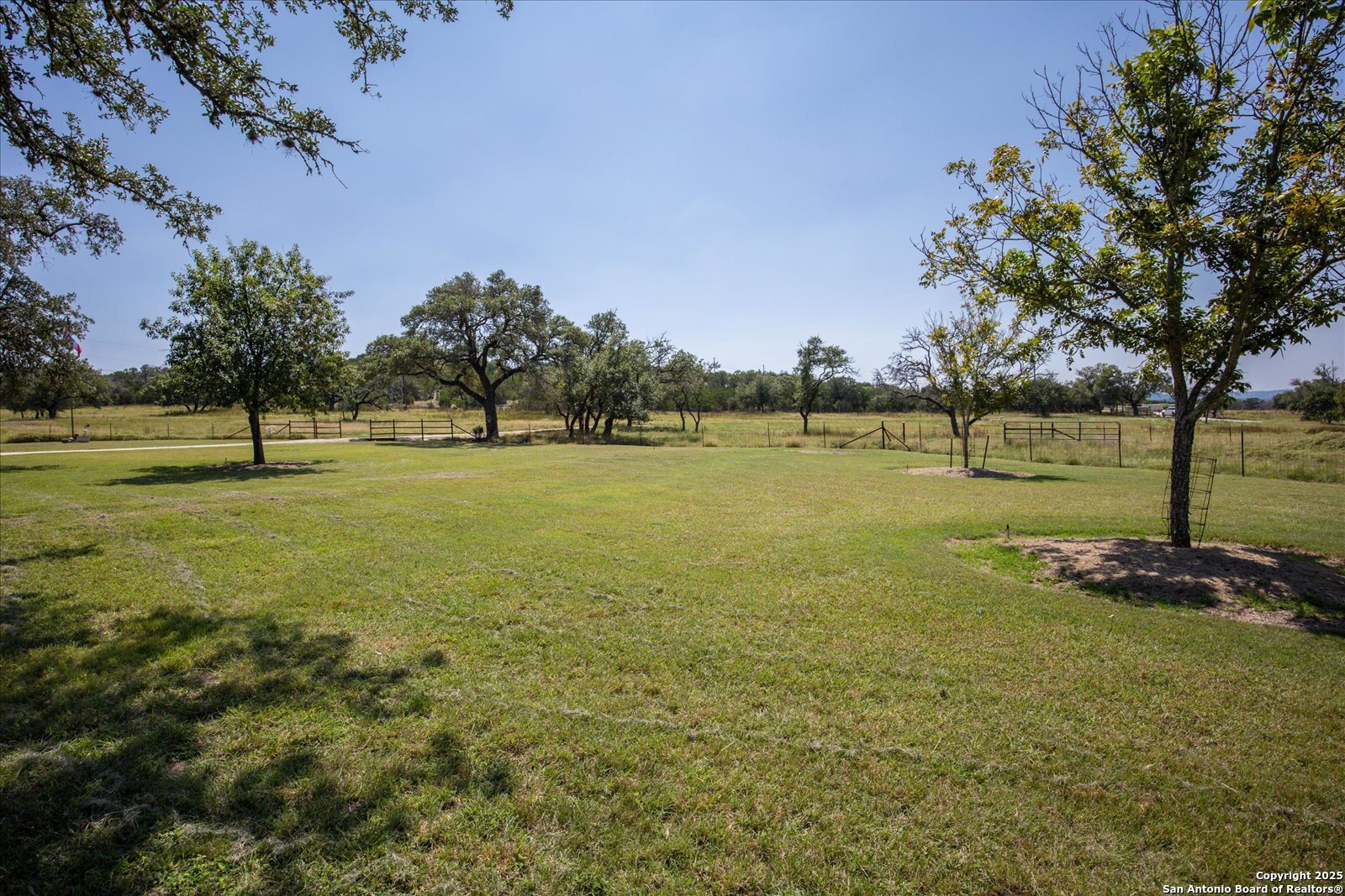34 Cravey Road Boerne, TX 78006 - Photo 57 of 69 a view of a field with trees in the background