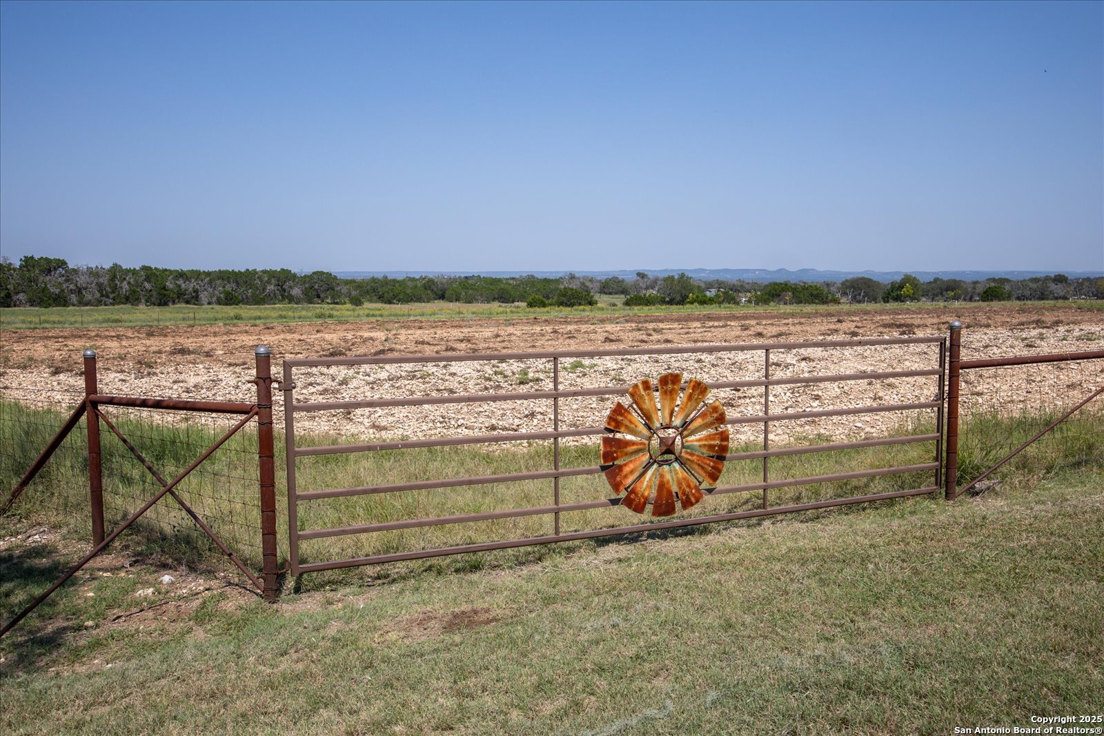 34 Cravey Road Boerne, TX 78006 - Photo 61 of 69 a view of a lake with a mountain in the background