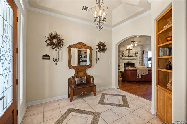 a view of a dining room and livingroom with furniture window and wooden floor