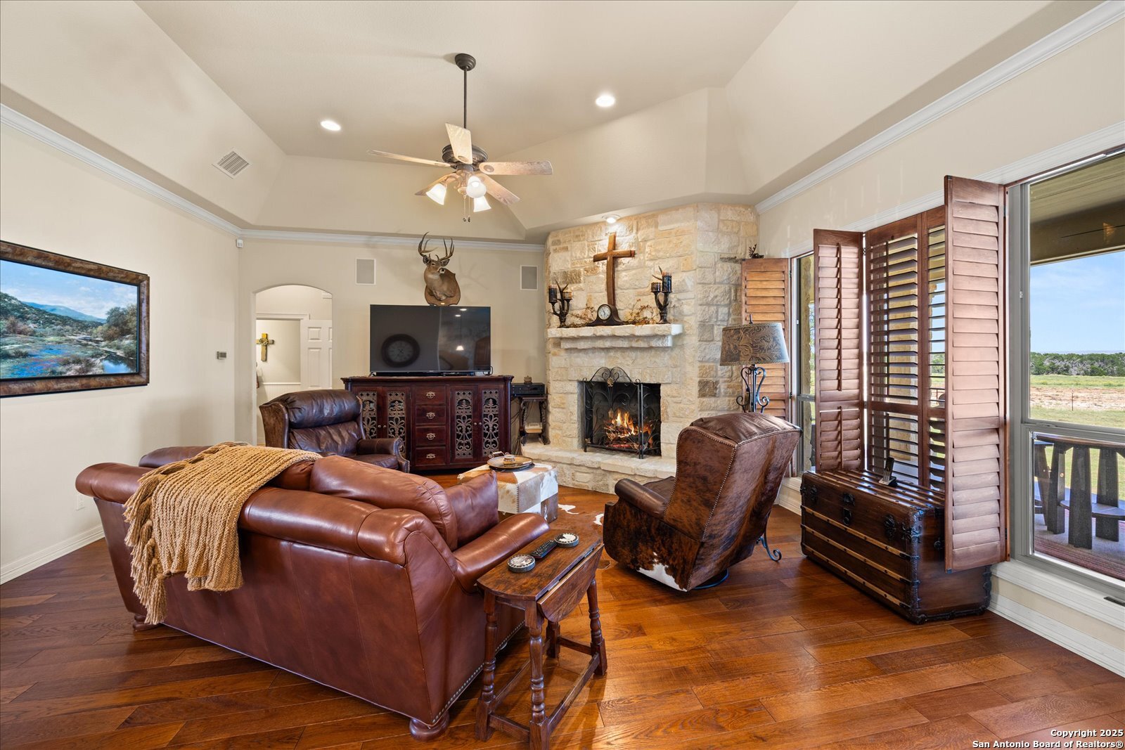 34 Cravey Road Boerne, TX 78006 - Photo 10 of 69 a living room with furniture a fireplace and a flat screen tv