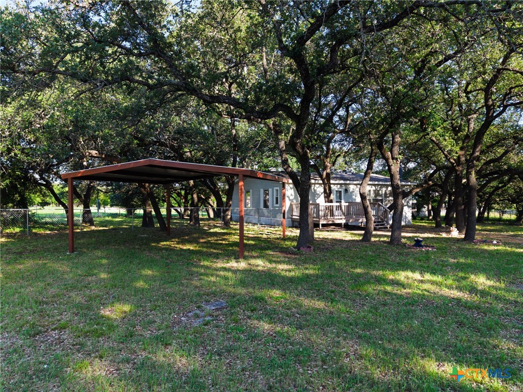 2739 Willow Loop Kempner, TX 76539 - Photo 1 of 30 a view of a big yard with a table and chairs under an umbrella
