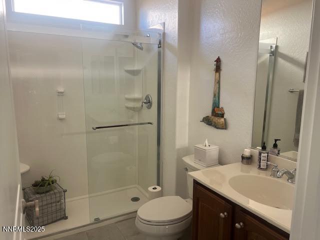 1220 Cliff Park Way Reno, NV 89523 - Photo 14 of 17 a bathroom with a granite countertop sink toilet a mirror and shower