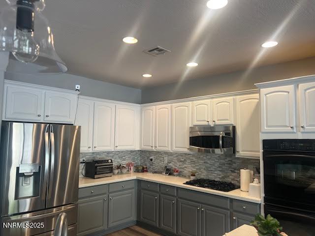 1220 Cliff Park Way Reno, NV 89523 - Photo 5 of 17 a kitchen with stainless steel appliances granite countertop a refrigerator sink and cabinets