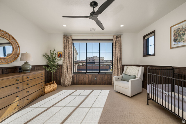 4871 South Homestead Way Washington, UT 84780 - Photo 72 of 151 Bedroom with a nursery area, a wainscoted wall, wooden walls, light carpet, and ceiling fan