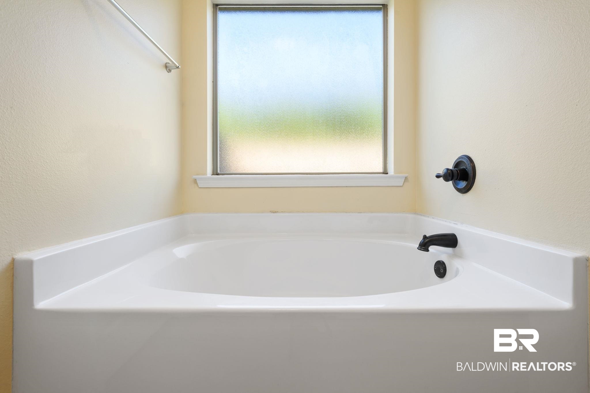 25234 Fairfax Road Daphne, AL 36526 - Photo 24 of 45 Bathroom with a textured wall and a garden tub