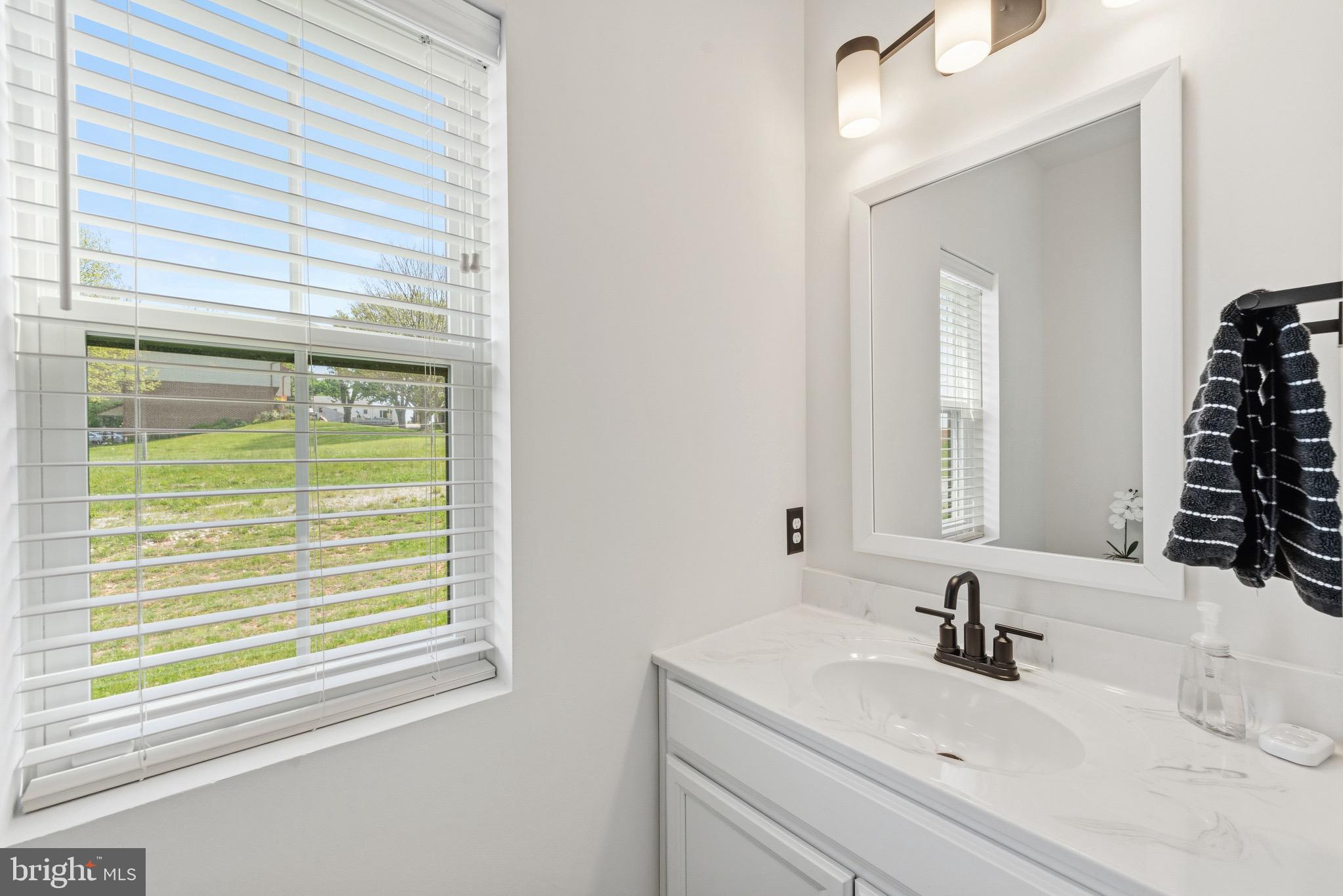 79 Beck Road York, PA 17403 - Photo 18 of 38 a bathroom with a sink and a mirror