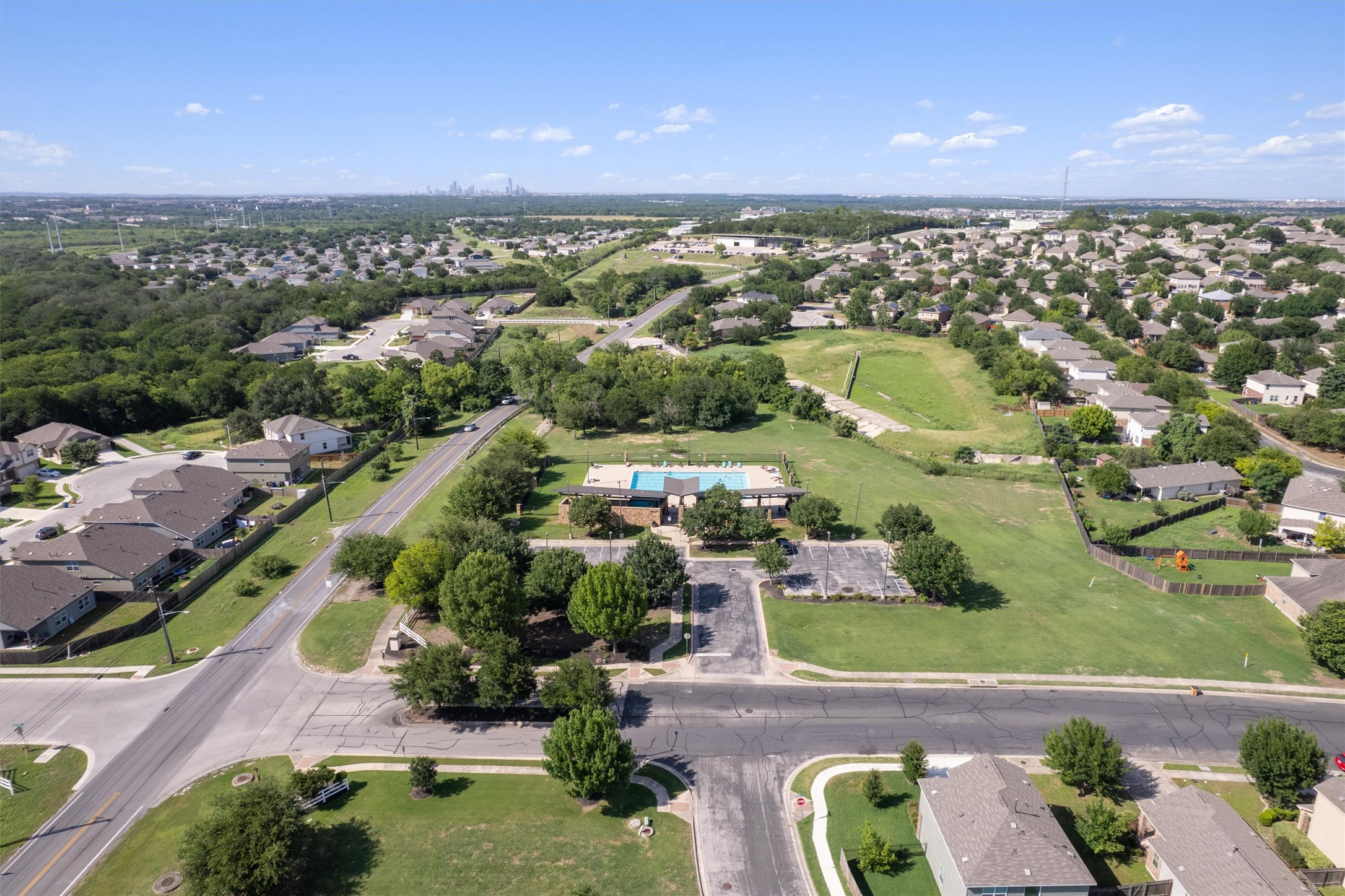 5825 Silver Screen Drive Austin, TX 78747 - Photo 31 of 40 An aerial panorama reveals a community pool at the heart of a vibrant residential neighborhood.