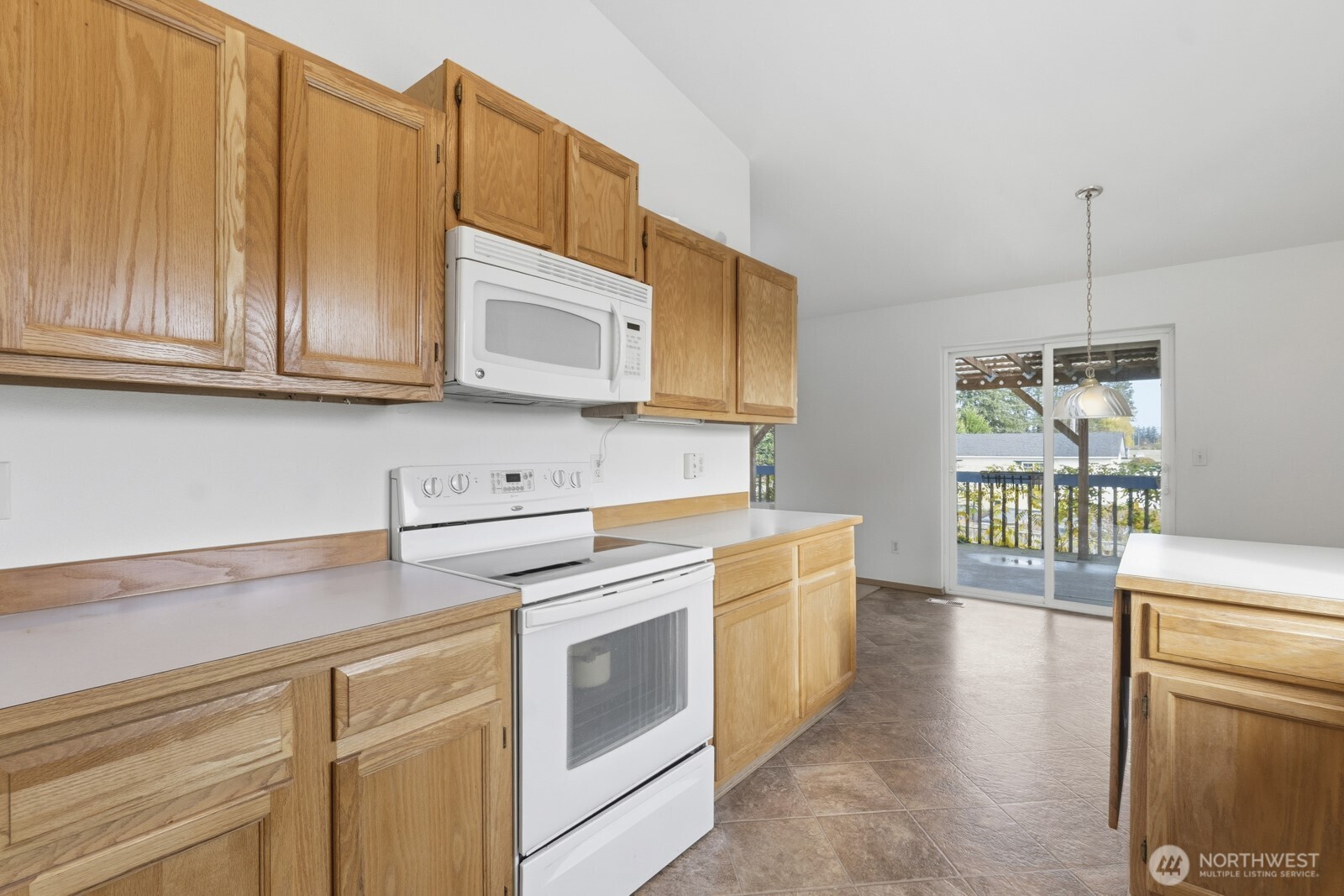 14905 Prairie Vista Loop Southeast Yelm, WA 98597 - Photo 11 of 40 a kitchen with stainless steel appliances granite countertop a sink a stove and cabinets
