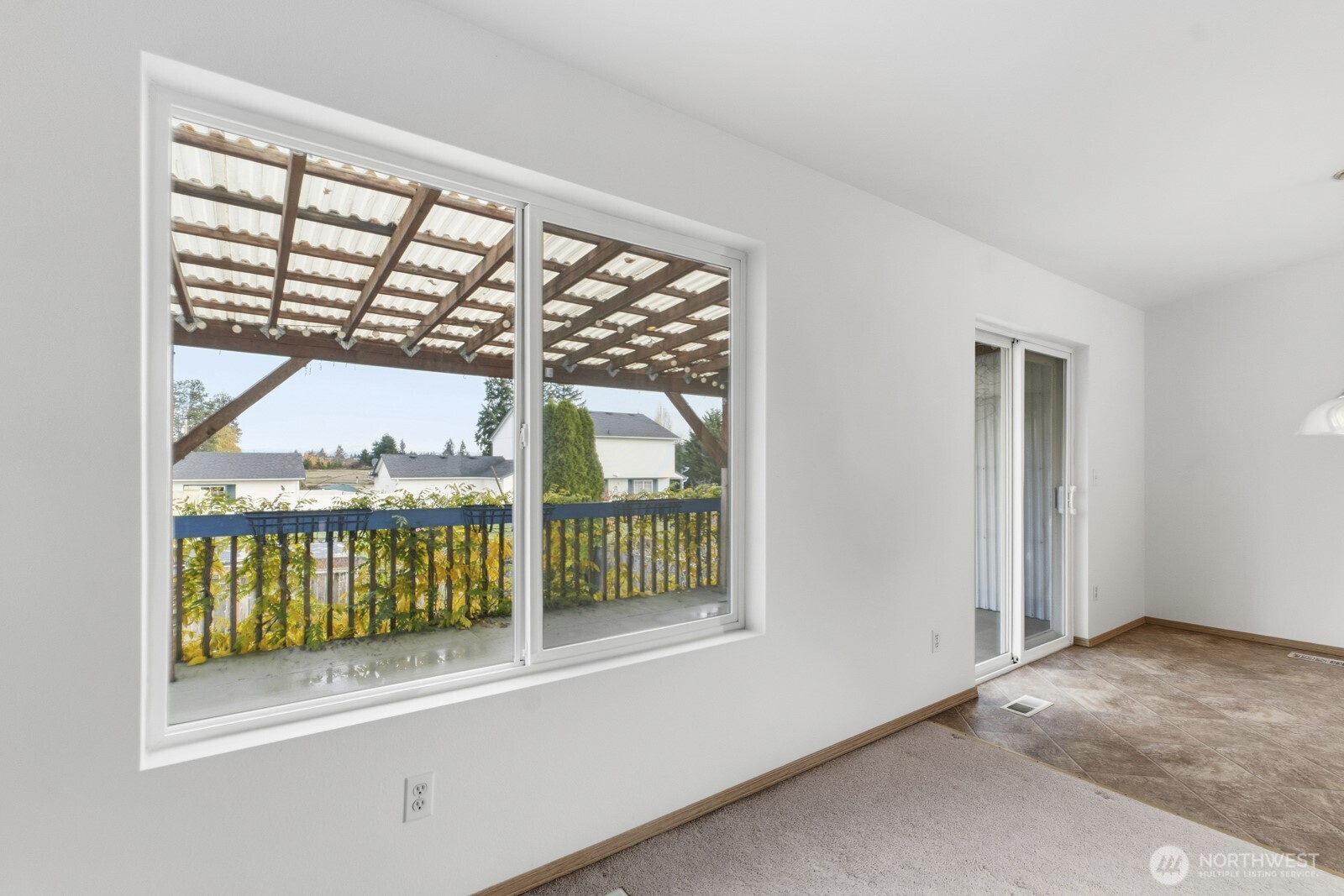 14905 Prairie Vista Loop Southeast Yelm, WA 98597 - Photo 5 of 40 an empty room with a balcony