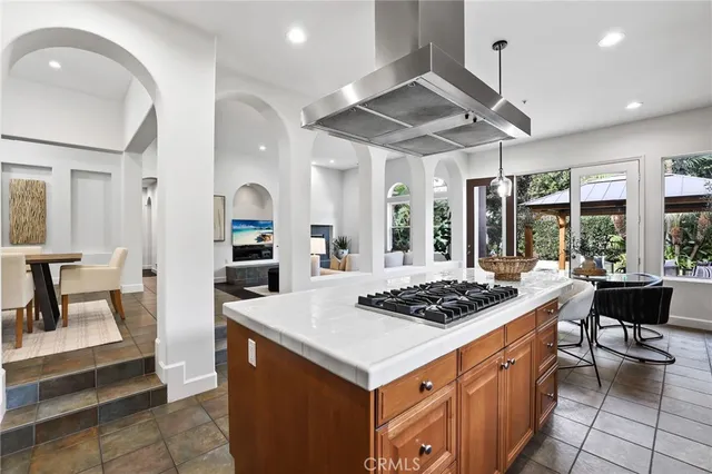 a large kitchen with a table and chairs