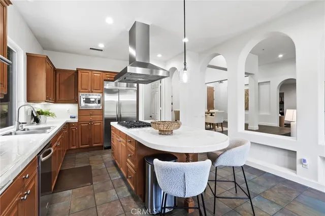 a dining room with furniture a window and a kitchen view