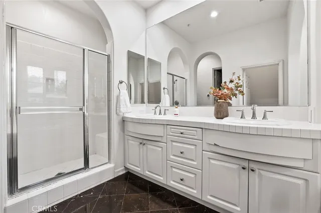 a patio view with a table and chairs under an umbrella