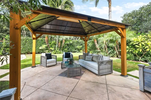 a view of patio with couches and pool