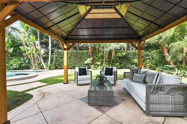 a view of yard from deck patio and outdoor seating