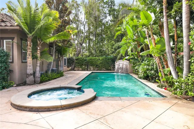 a view of a swimming pool with a patio