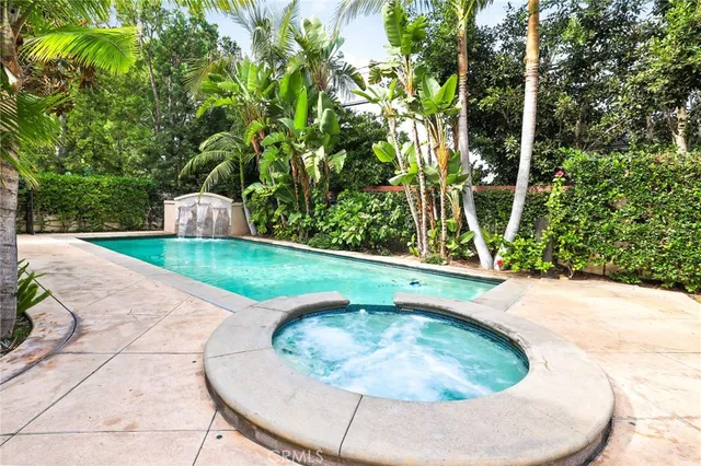 a view of backyard with swimming pool