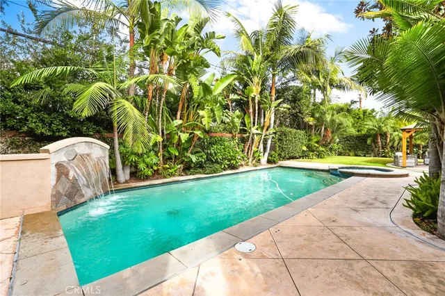 a view of swimming pool with a yard