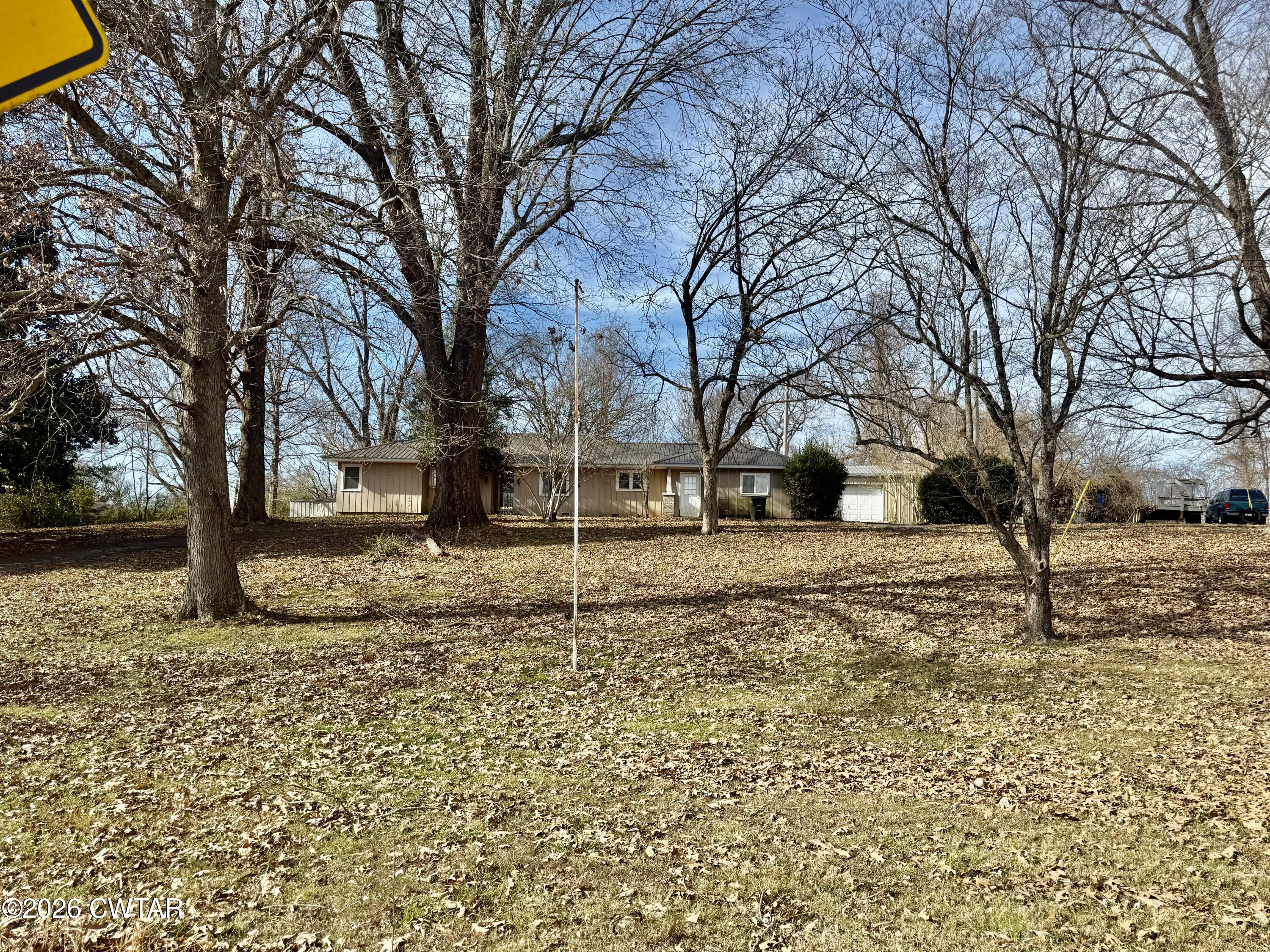 519 South Chestnut Street Troy, TN 38260 - Photo 5 of 16 a view of house covered with snow in outdoor space