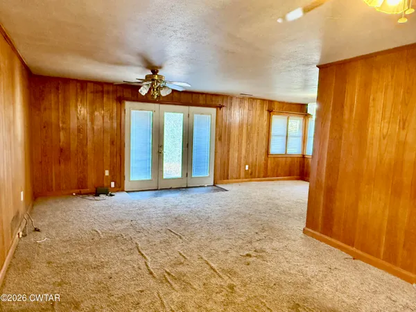 a view of an empty room with a fireplace