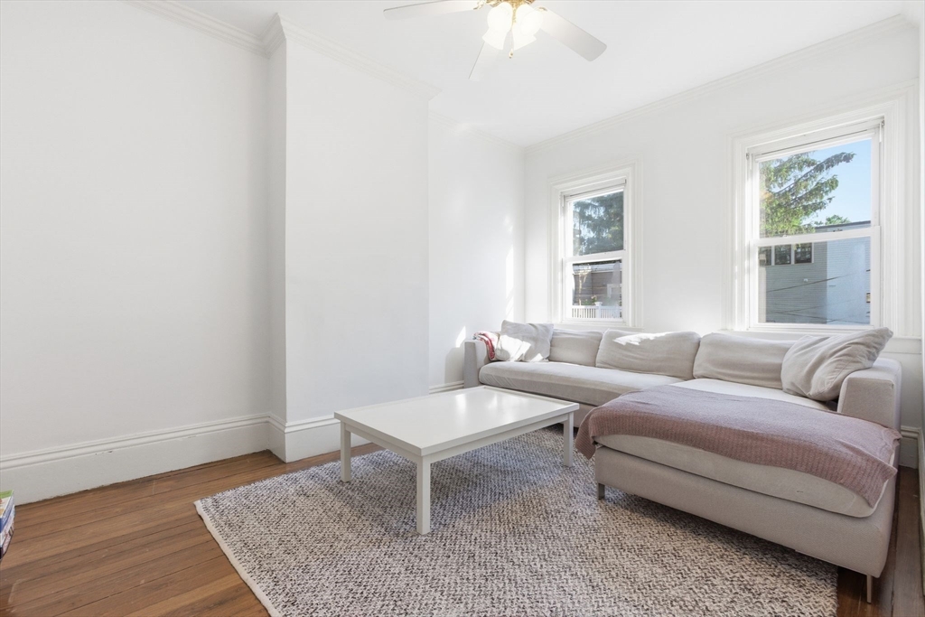 38 Bartlett Street Boston, MA 02129 - Photo 20 of 37 a living room with furniture and a rug