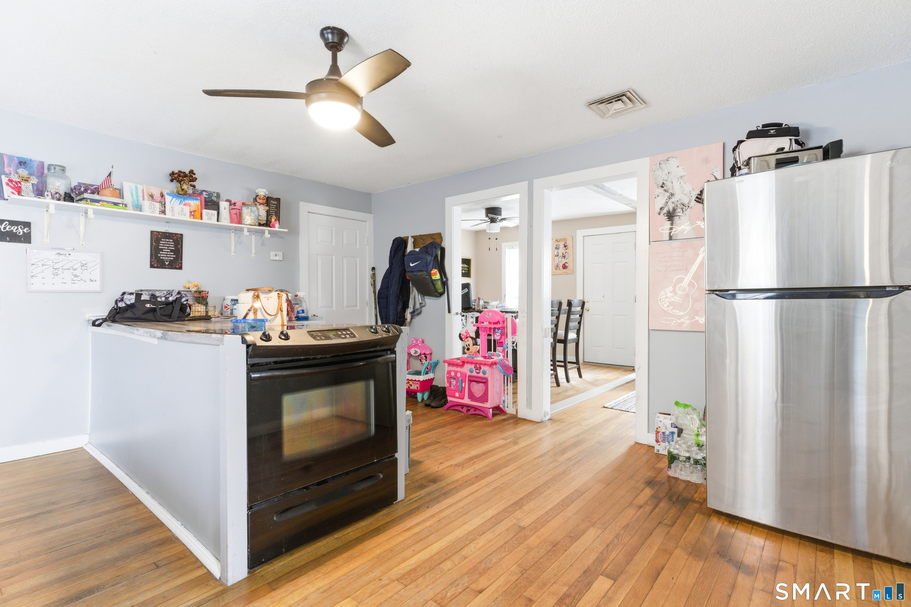 36 Church Street Killingly, CT 06241 - Photo 23 of 39 a kitchen with refrigerator a stove and wooden floor