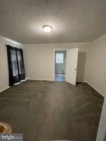 an empty room with a empty space and window