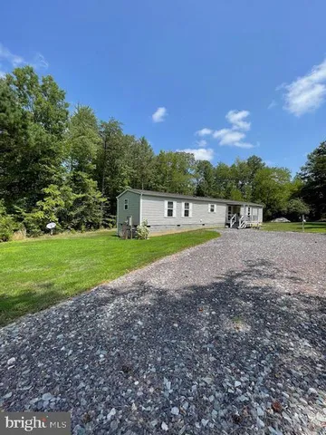 a view of a swimming pool with a yard