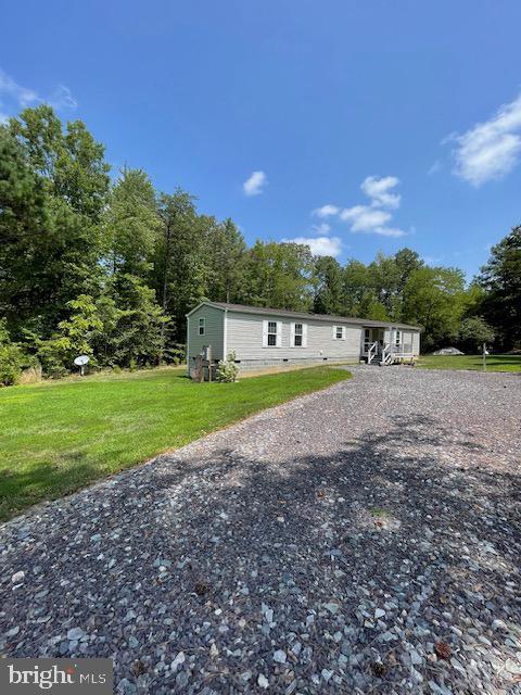 535 Parrish Lane Colonial Beach, VA 22443 - Photo 18 of 18 a view of a swimming pool with a yard