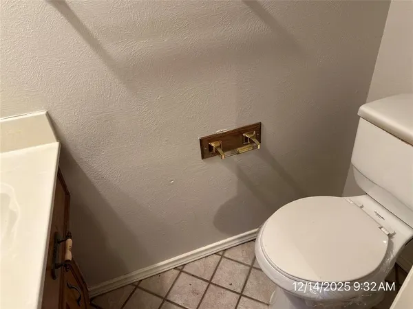 a bathroom with a toilet and a sink
