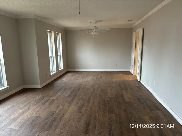 a kitchen with granite countertop a sink stove and cabinets