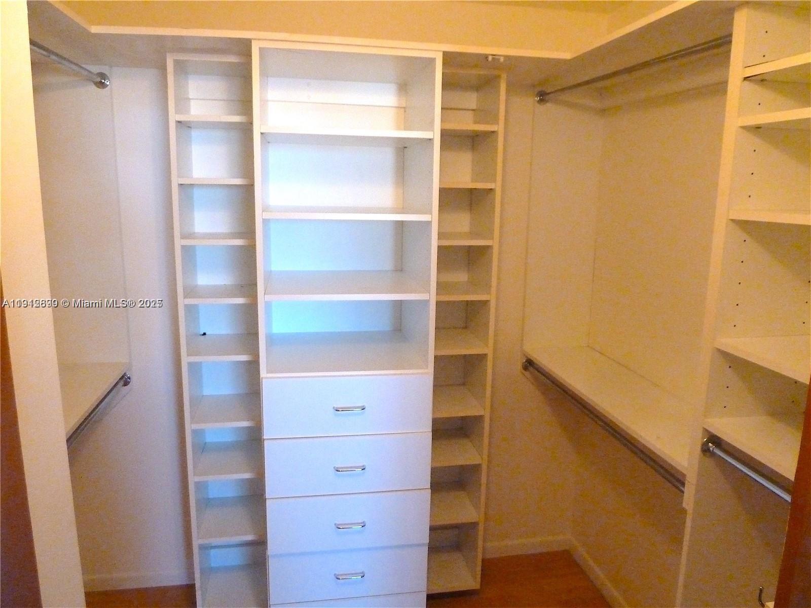 1688 West Avenue, Unit 405 Miami Beach, FL 33139 - Photo 23 of 23 a view of walk in closet with empty racks