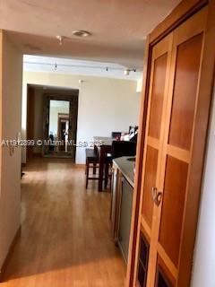 1688 West Avenue, Unit 405 Miami Beach, FL 33139 - Photo 4 of 23 a view of a hallway with furniture and floor to ceiling window