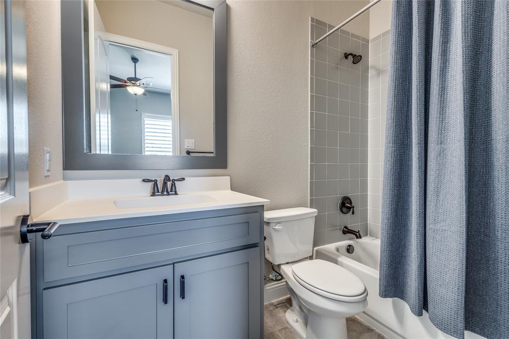 11112 Lacey Oak Ridge Flower Mound, TX 76226 - Photo 30 of 40 a bathroom with a sink toilet and shower