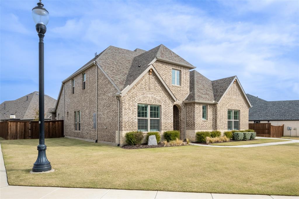 11112 Lacey Oak Ridge Flower Mound, TX 76226 - Photo 5 of 40 a front view of a house with a yard