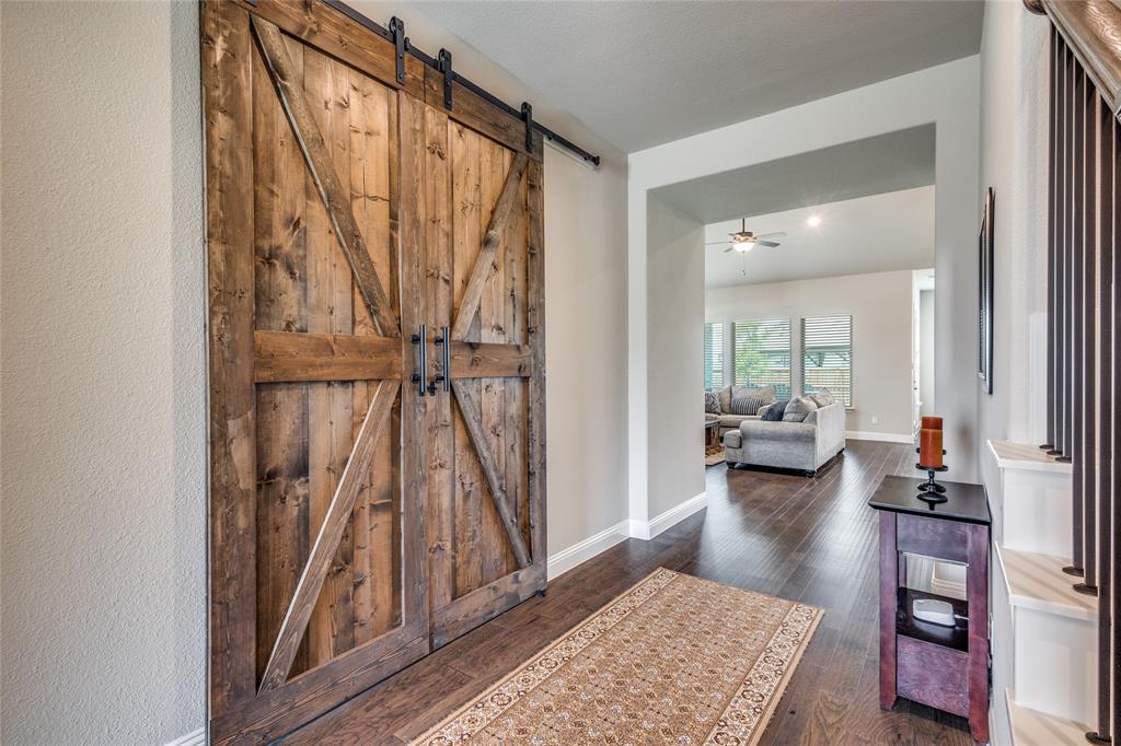 11112 Lacey Oak Ridge Flower Mound, TX 76226 - Photo 9 of 40 a living room with a couch and a table