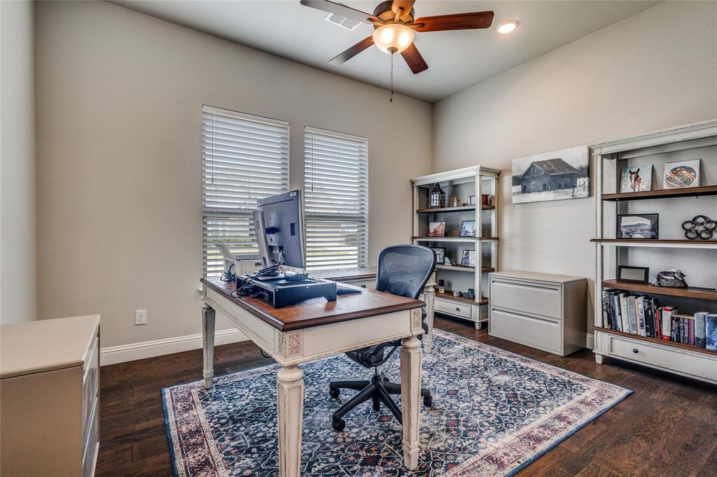11112 Lacey Oak Ridge Flower Mound, TX 76226 - Photo 10 of 40 a view of a workspace with furniture and a bookshelf