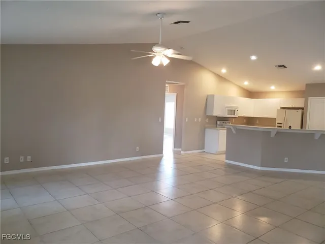 a view of a kitchen with a sink cabinets and window