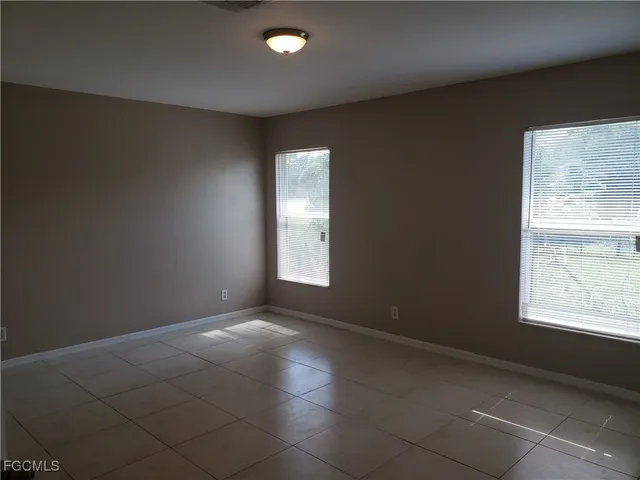 an empty room with windows