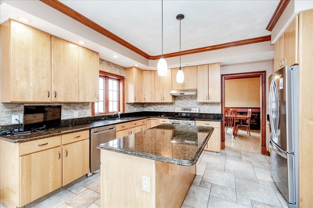 3 Danielle Drive Danvers, MA 01923 - Photo 13 of 41 a kitchen with stainless steel appliances granite countertop a sink and a refrigerator