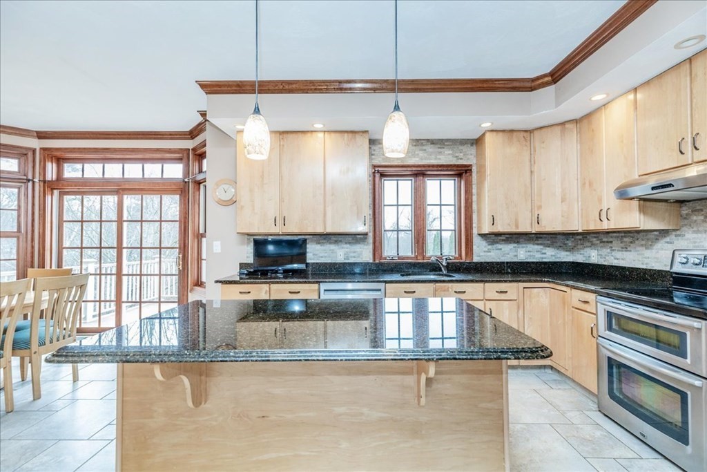 3 Danielle Drive Danvers, MA 01923 - Photo 17 of 41 a kitchen with granite countertop a stove a sink and a counter space