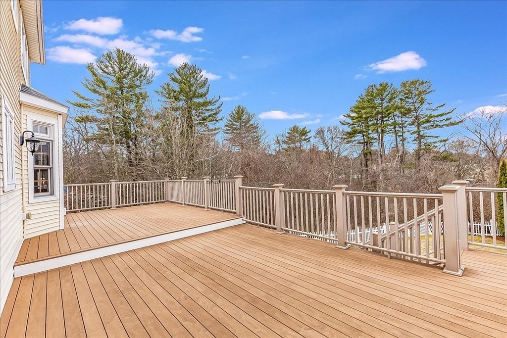 3 Danielle Drive Danvers, MA 01923 - Photo 22 of 41 a view of a swimming pool with wooden floor and fence