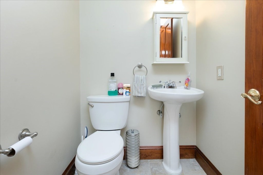 3 Danielle Drive Danvers, MA 01923 - Photo 26 of 41 a bathroom with a sink mirror toilet and a window
