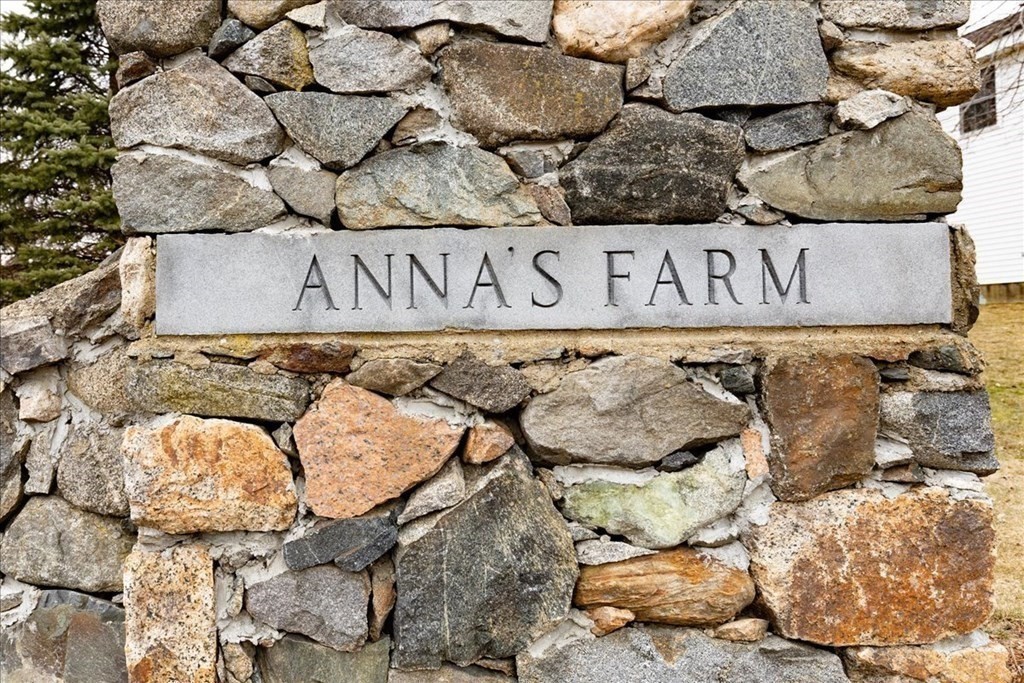 3 Danielle Drive Danvers, MA 01923 - Photo 3 of 41 a street sign on a brick wall