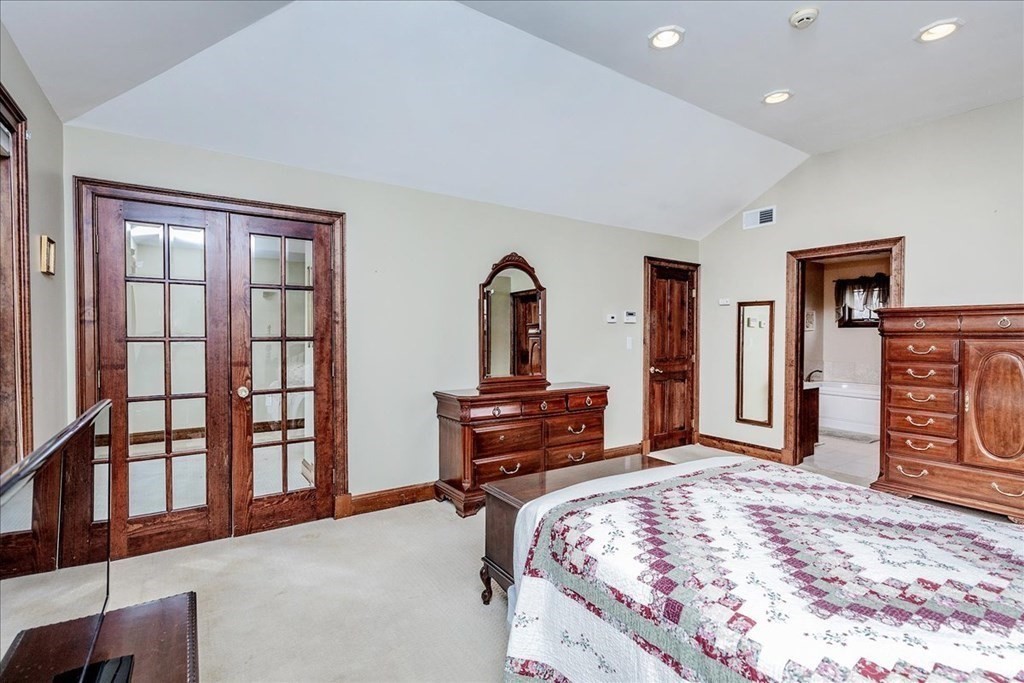 3 Danielle Drive Danvers, MA 01923 - Photo 31 of 41 a bedroom with a bed and a dresser with mirror