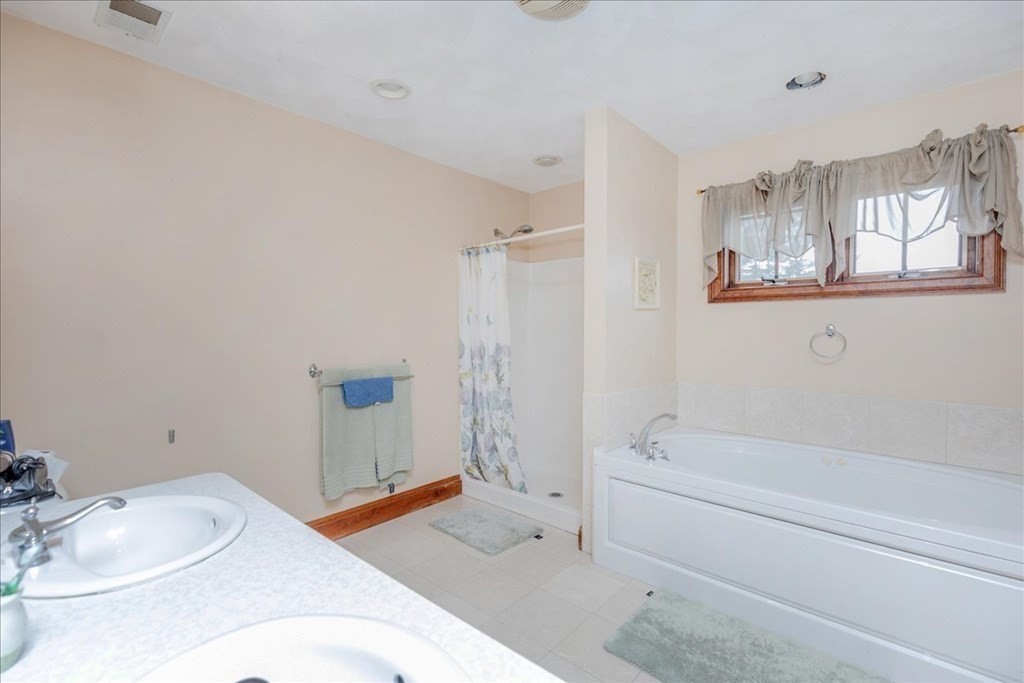 3 Danielle Drive Danvers, MA 01923 - Photo 33 of 41 a bathroom with a sink and bathtub with toilet