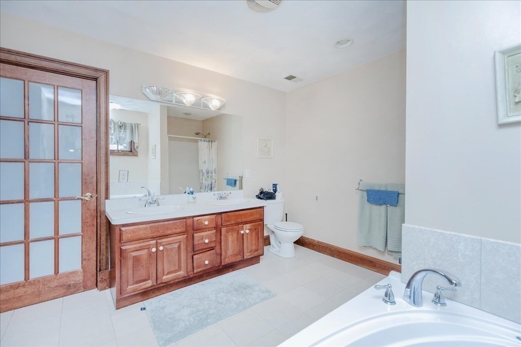 3 Danielle Drive Danvers, MA 01923 - Photo 35 of 41 a bathroom with a double vanity sink and a mirror