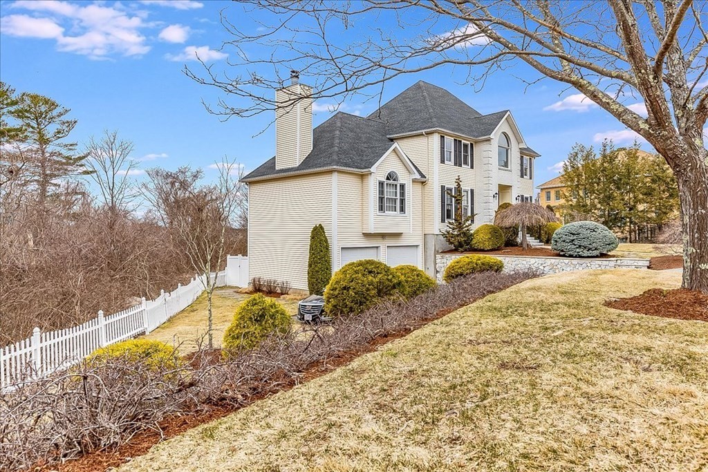 3 Danielle Drive Danvers, MA 01923 - Photo 4 of 41 a front view of a house with a yard