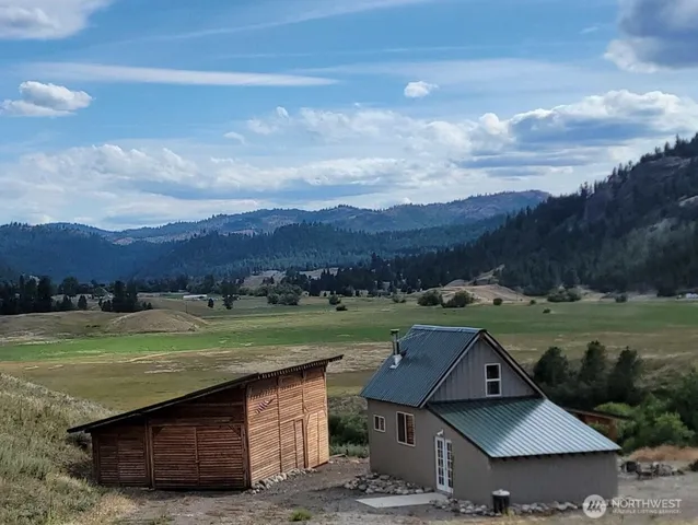 a view of a table and chairs in yard